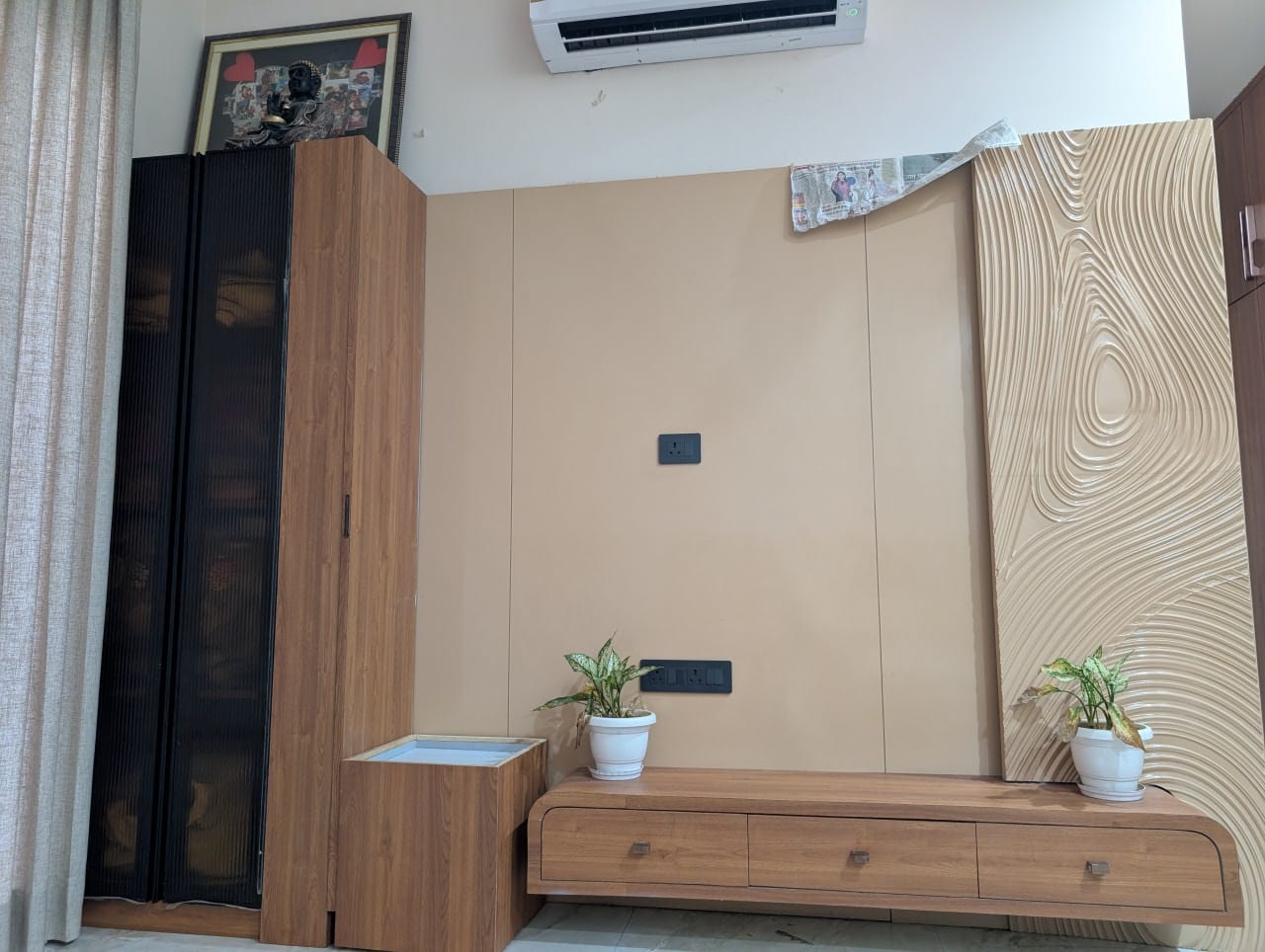 TV panel wall with wood finish cabinetry and decorative side treatment
